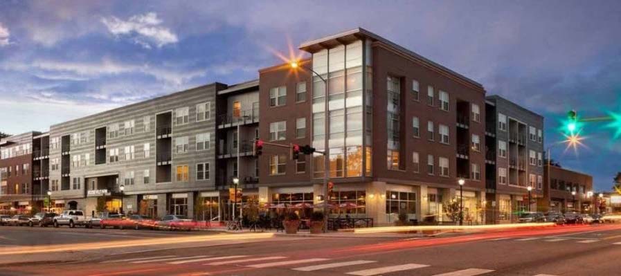 Mixed use building in downtown Longmont, Colorado, that incorporates shared and on-street parking opportunities, as well as a customized parking program based on area content.